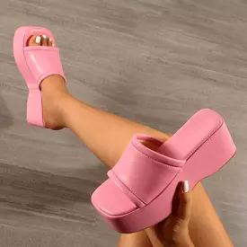 Block wedge sandals with peep toe.