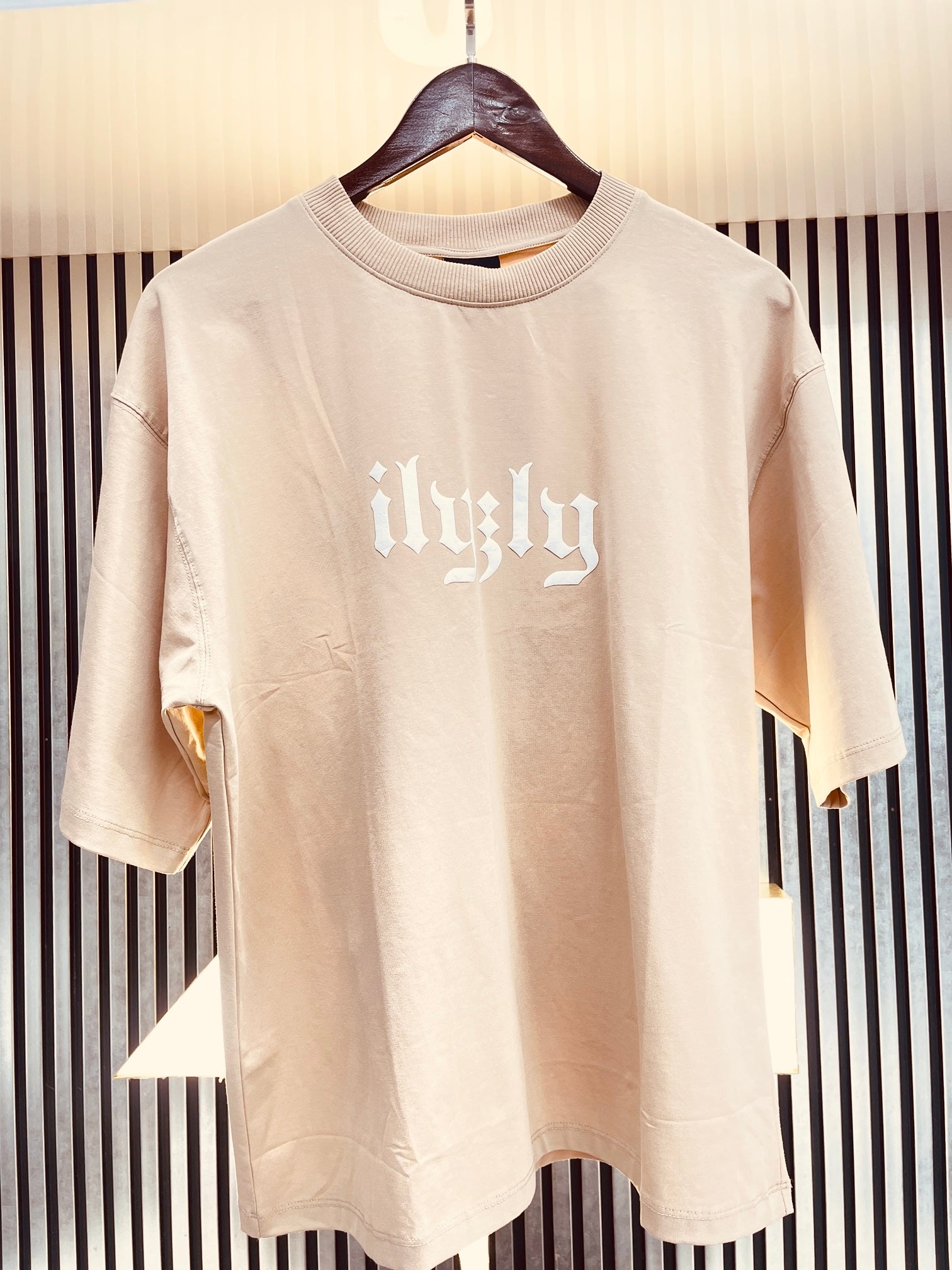 cream street style tee shirt with back print and drop shoulder style