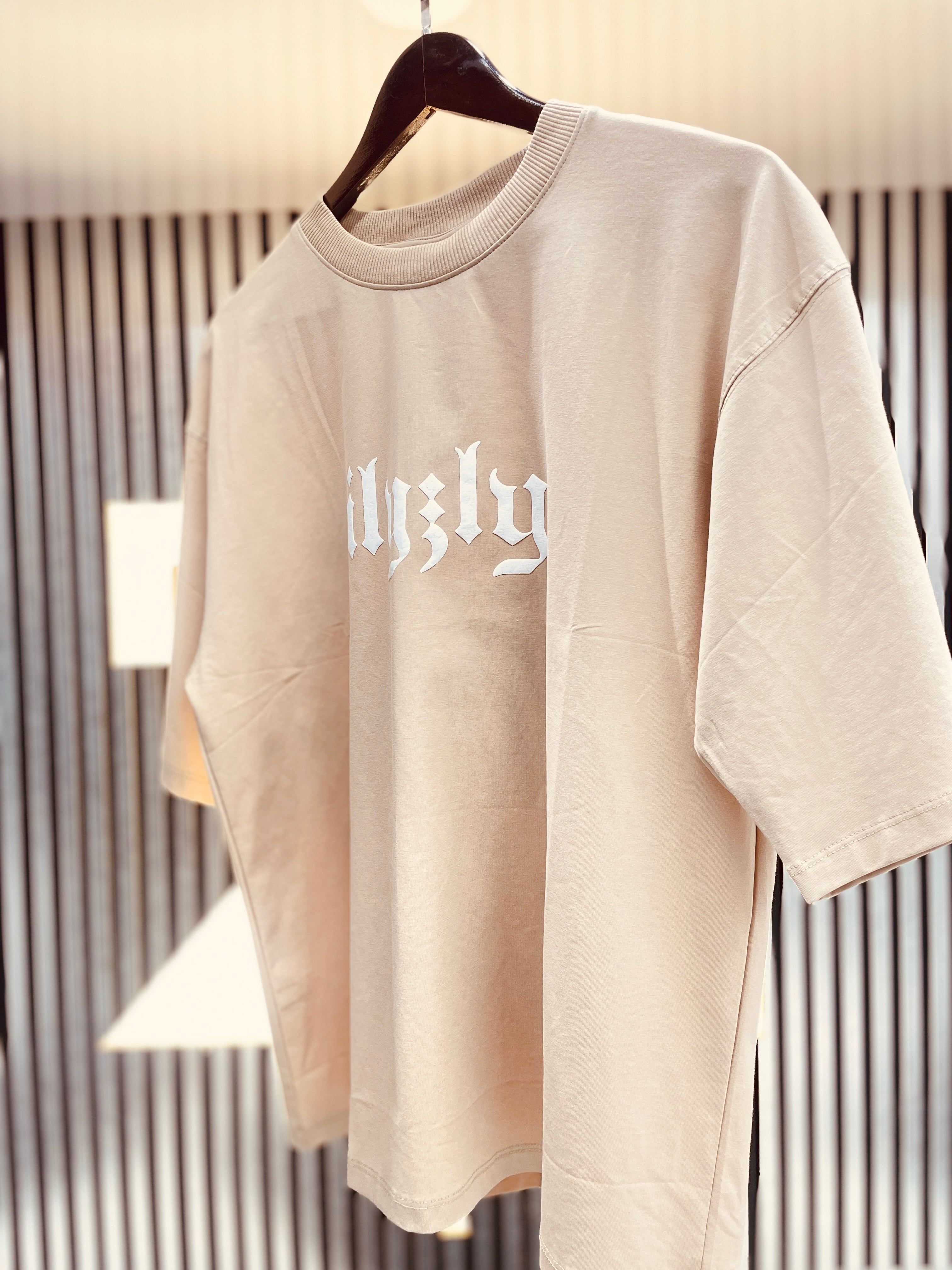 cream street style tee shirt with back print and drop shoulder style