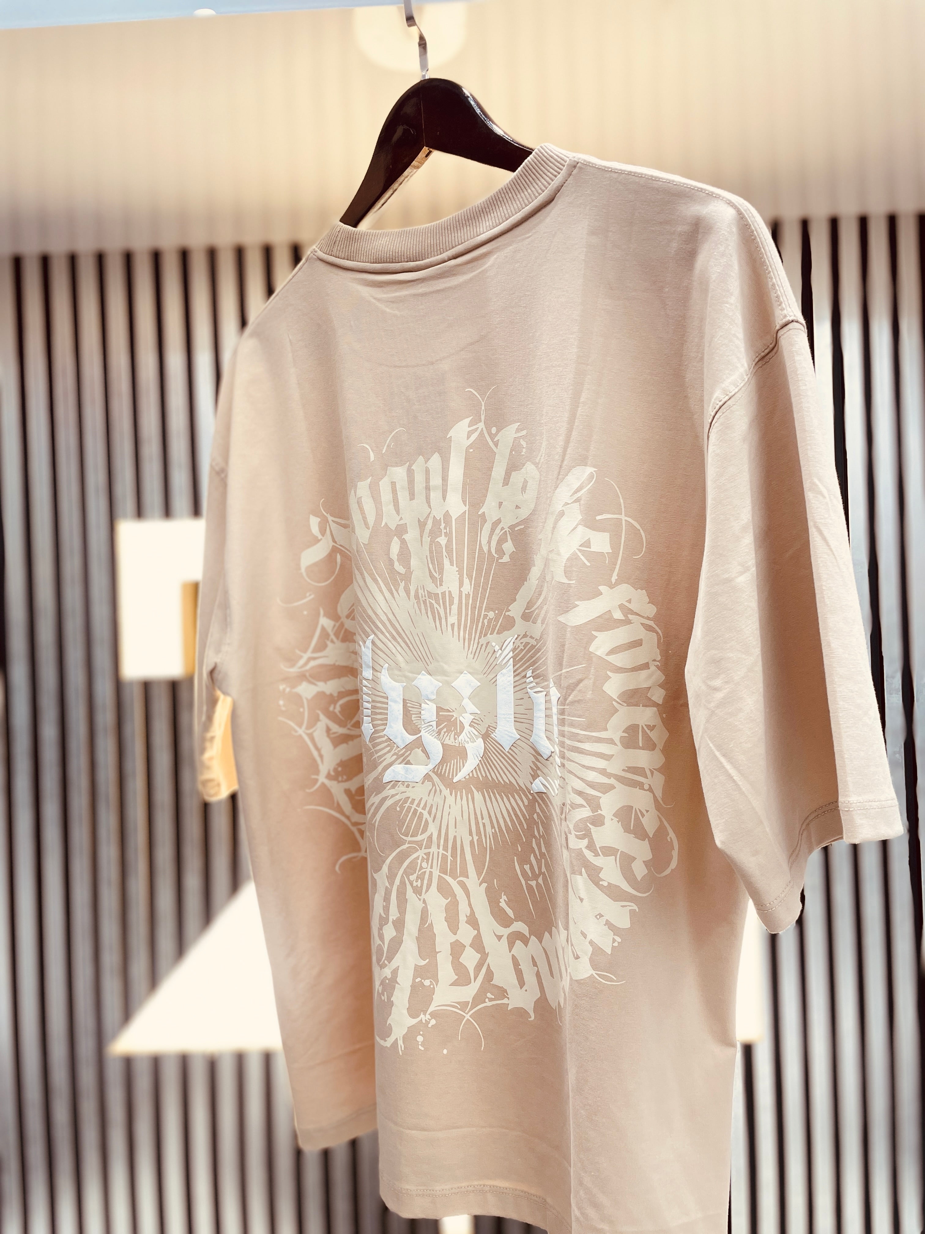 cream street style tee shirt with back print and drop shoulder style